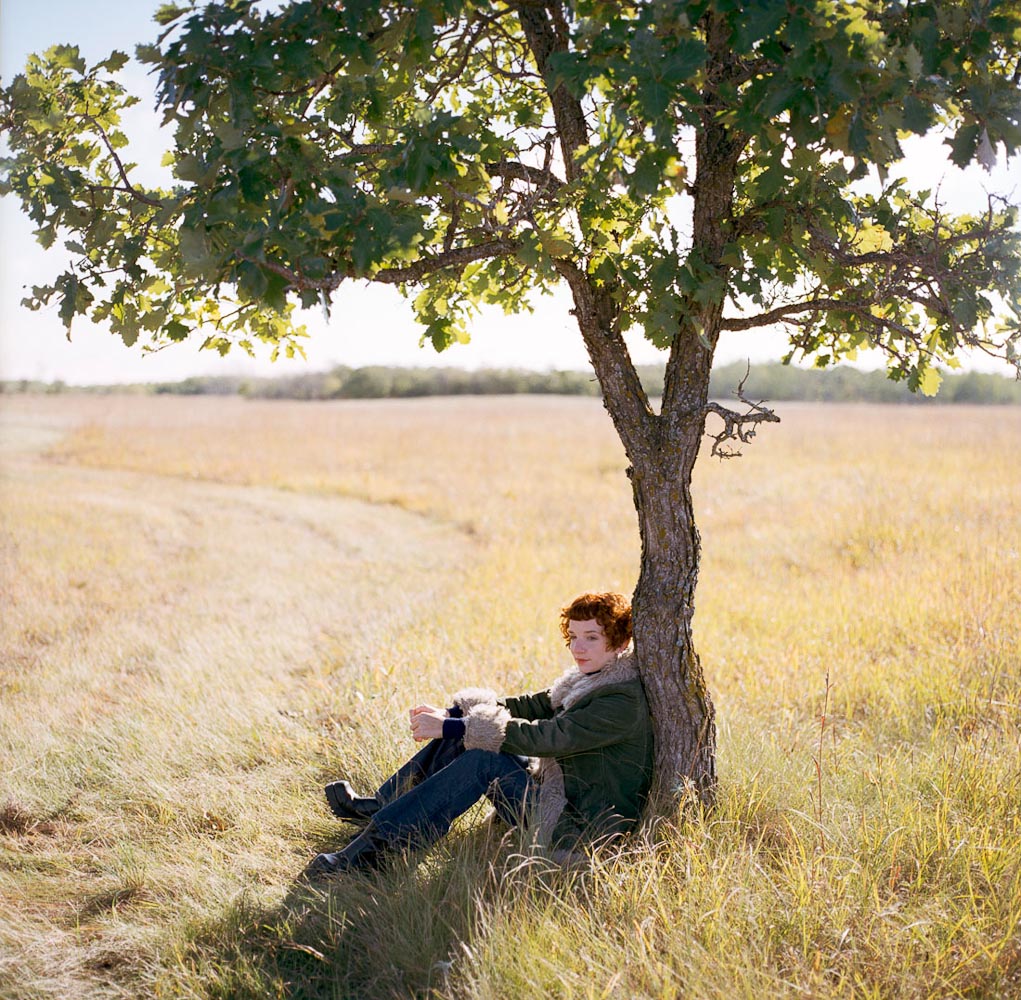 Woman under tree by winnipeg editorial photographer