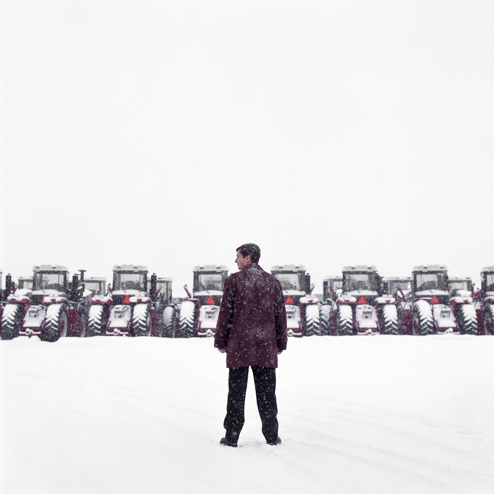 Craig Engel with tractors by winnipeg editorial photographer