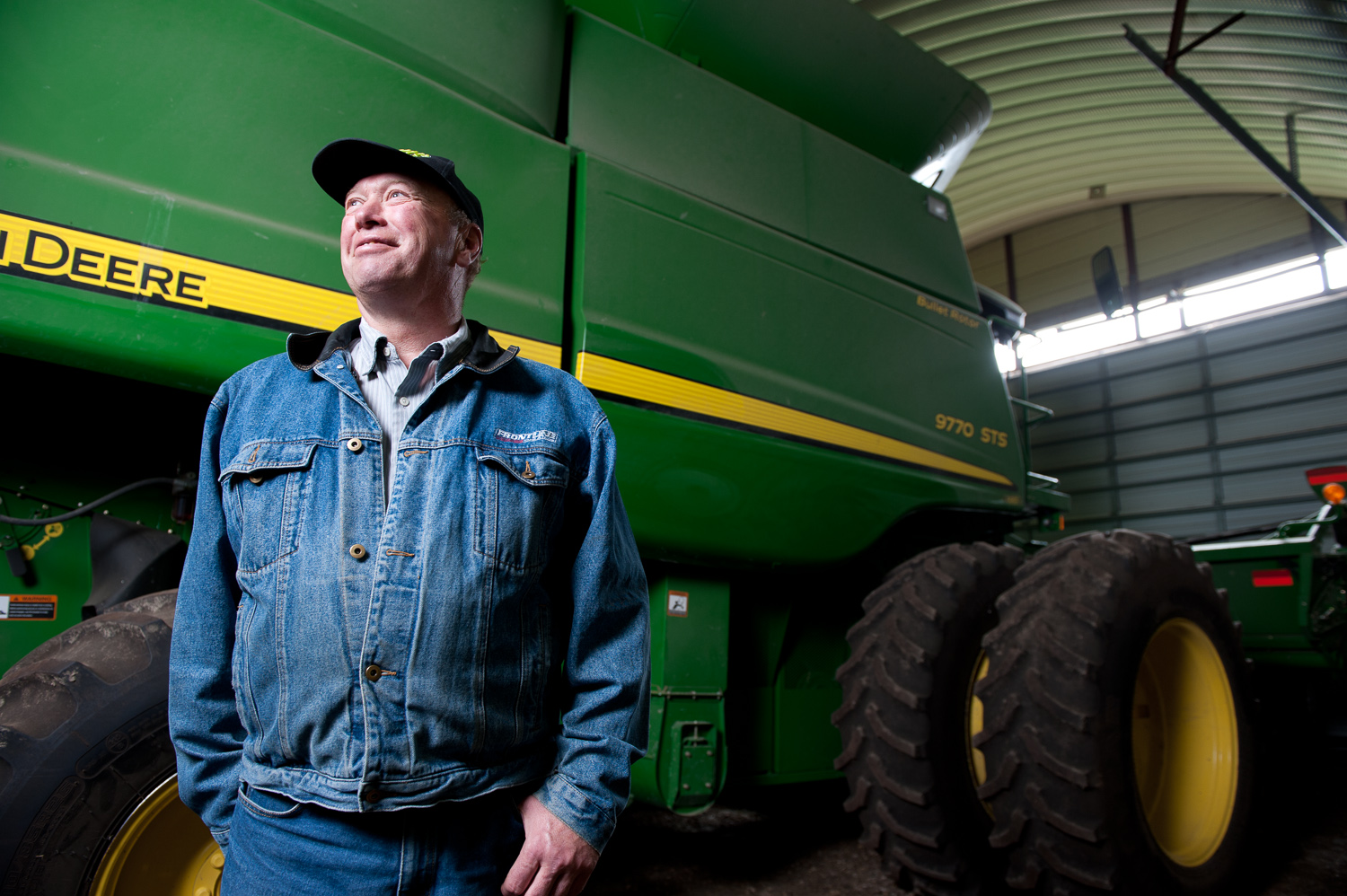 John Deere farmer by winnipeg commercial photographer