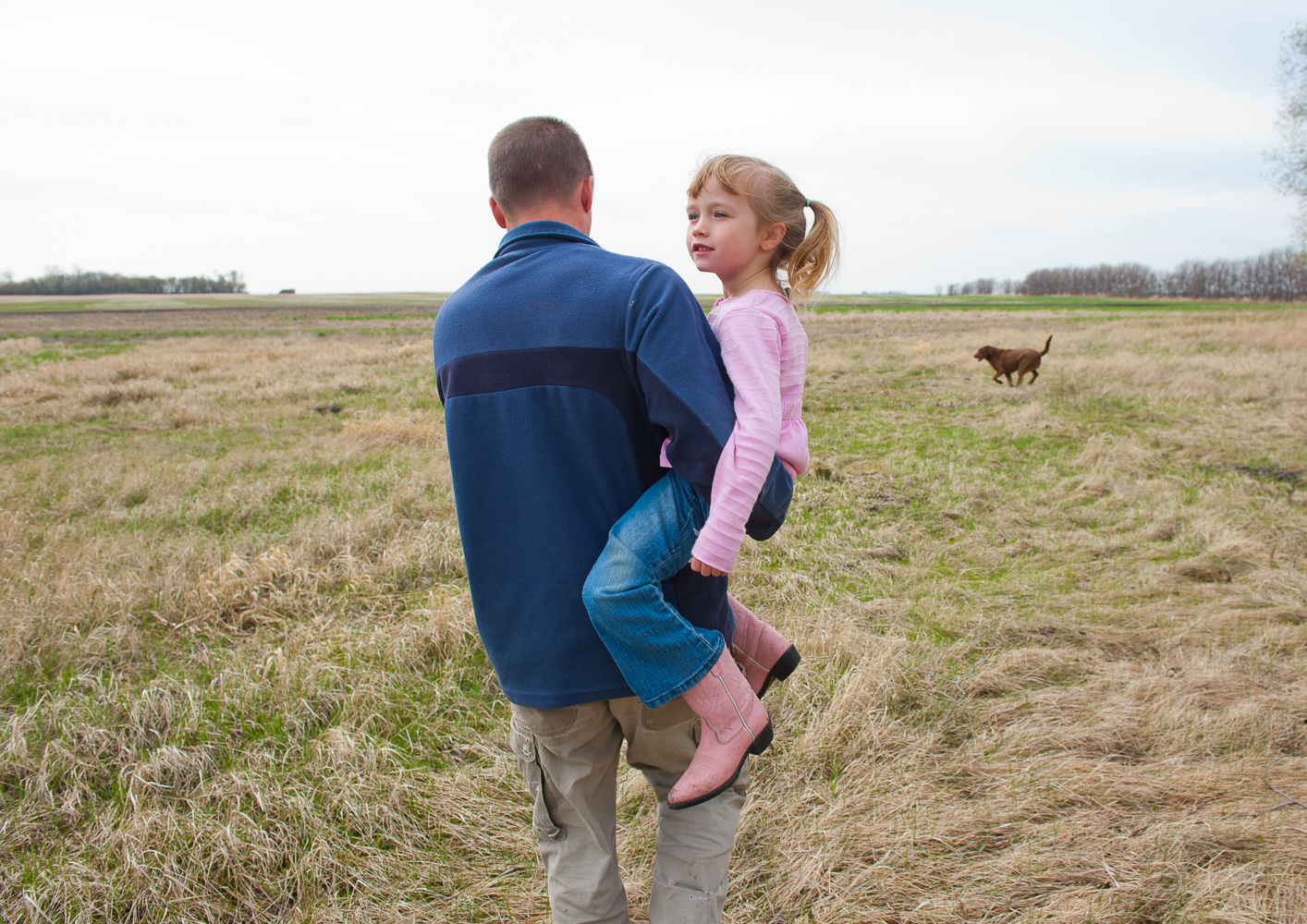Farmer with daughter by Winnipeg commercial photographer