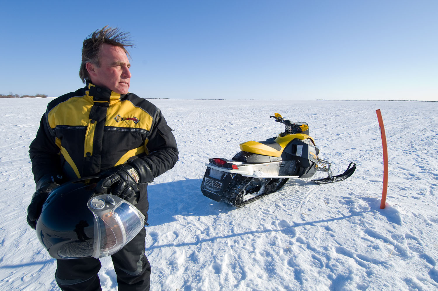 Snowmobiler  by Winnipeg editorial photographer