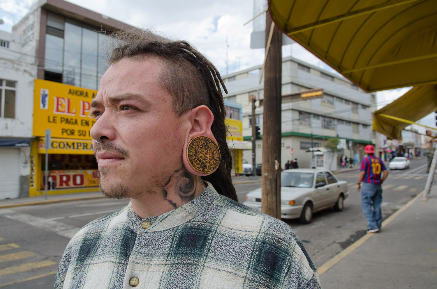 Large ear piercing by Winnipeg travel photographer