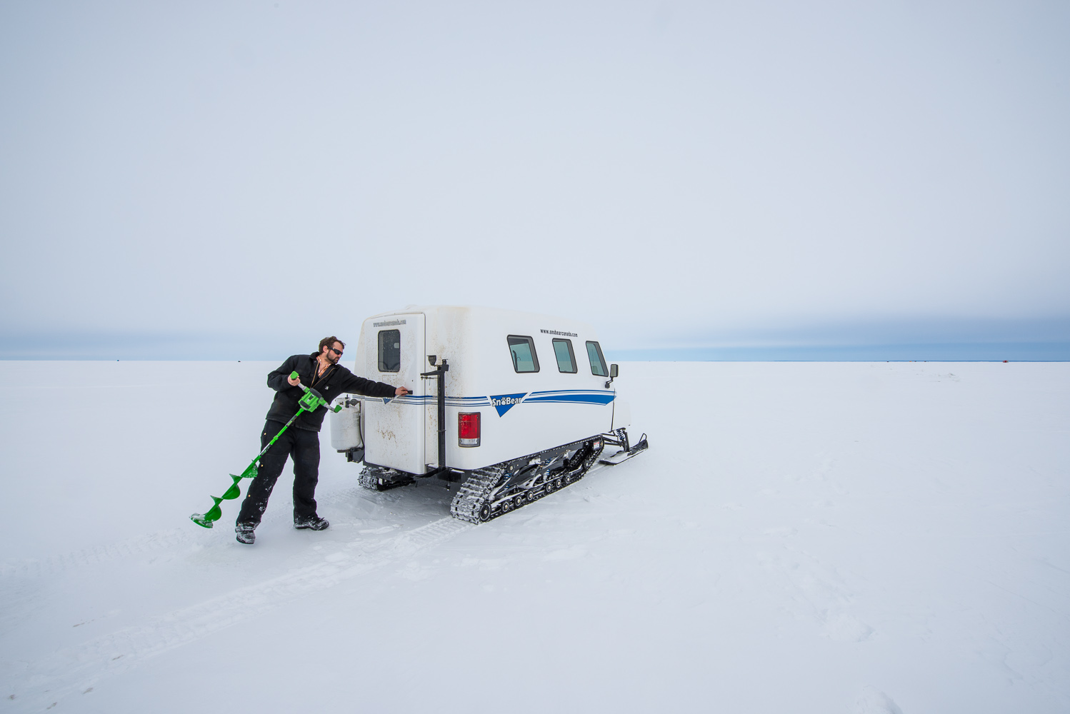 Ice fishing by Winnipeg commercial photographer
